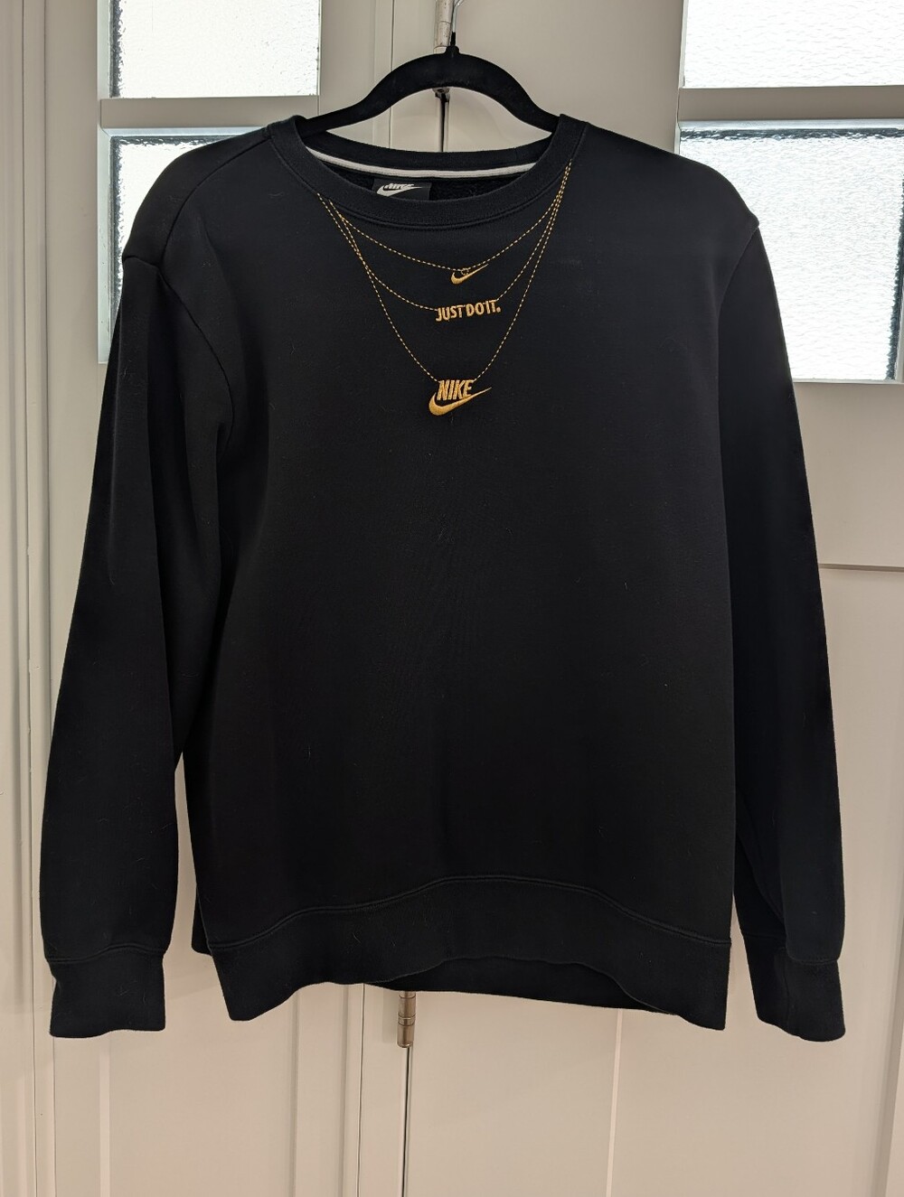 Nike Sportswear Glam Dunk crewneck sweatshirt featuring gold embroidery